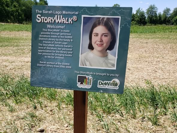 Sarah Lago Memorial StoryWalk sign with a photo of Sarah