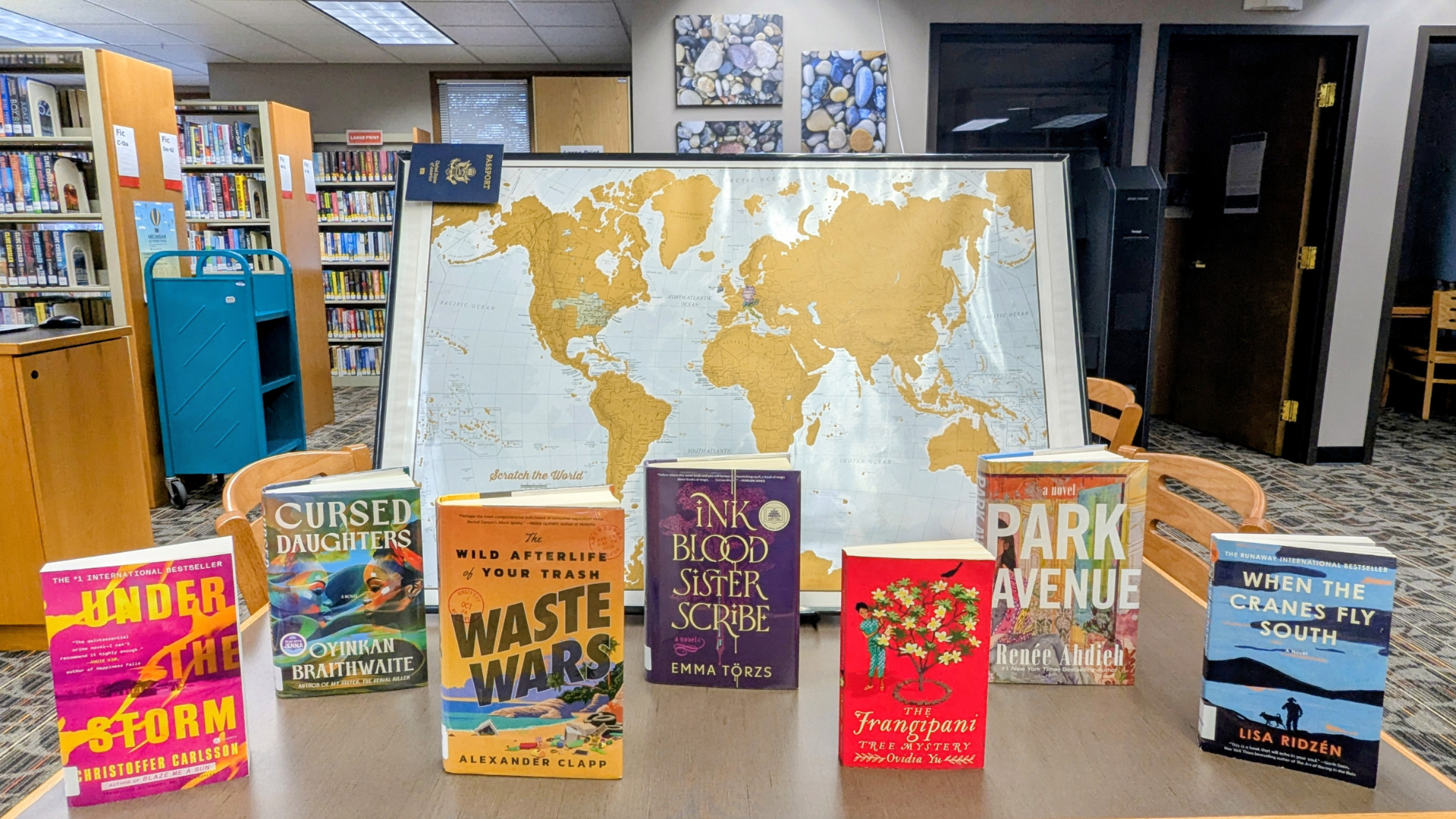Book covers on a table display centered on the Around the World category