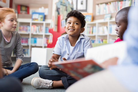 kids sitting and reading books