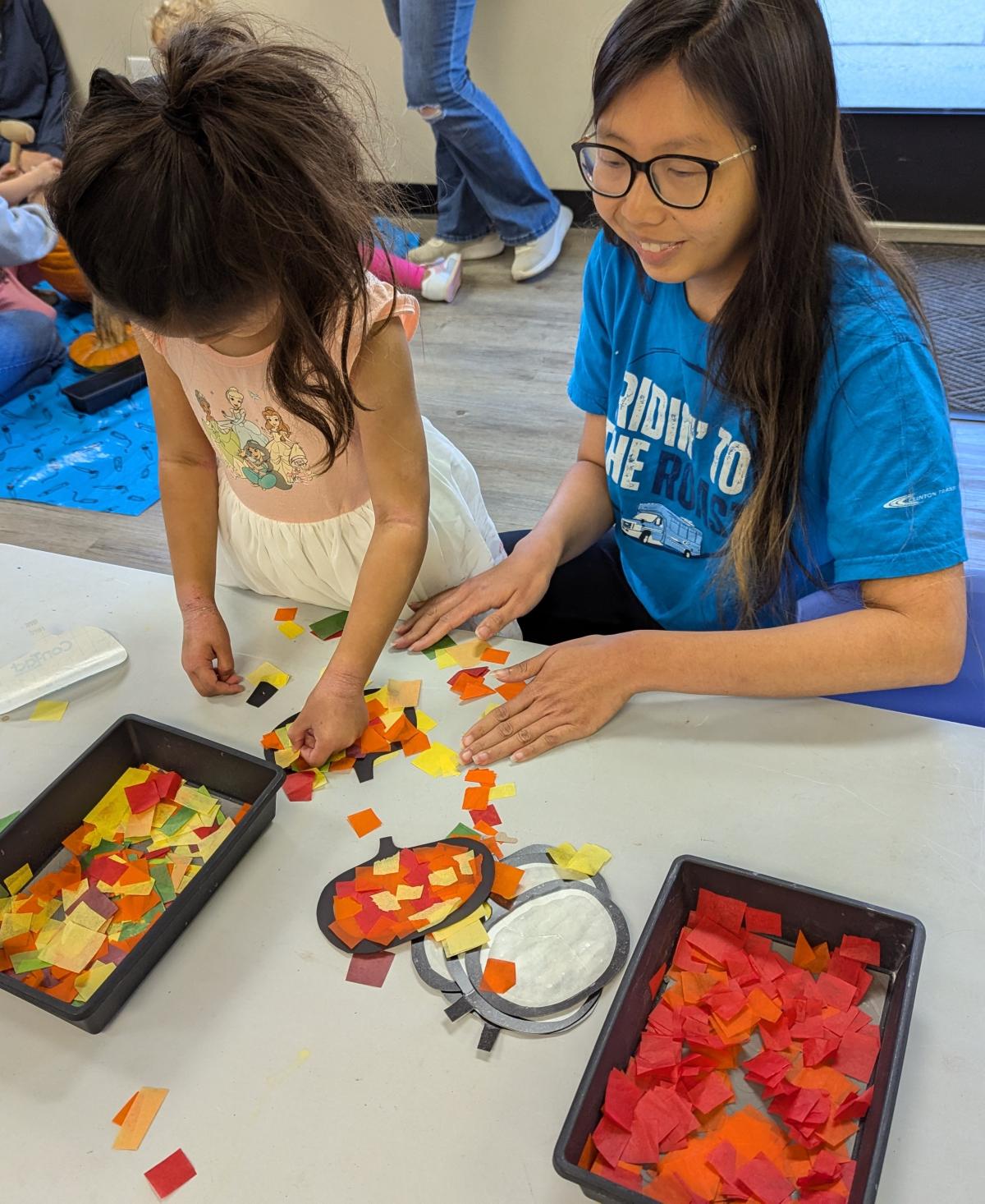 parent and child doing a craft