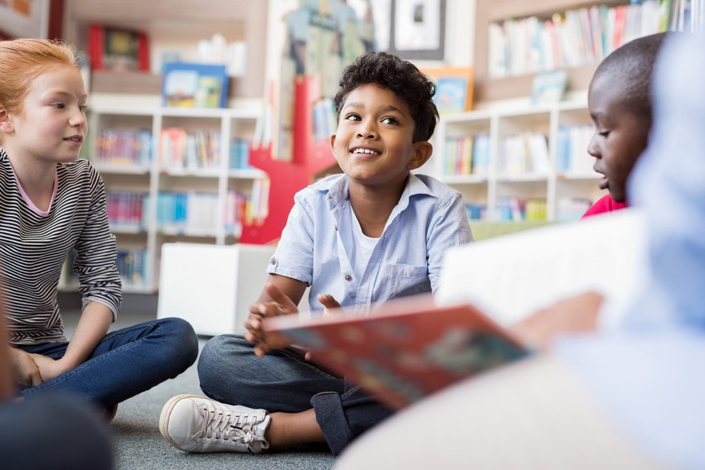 kids sitting and reading books